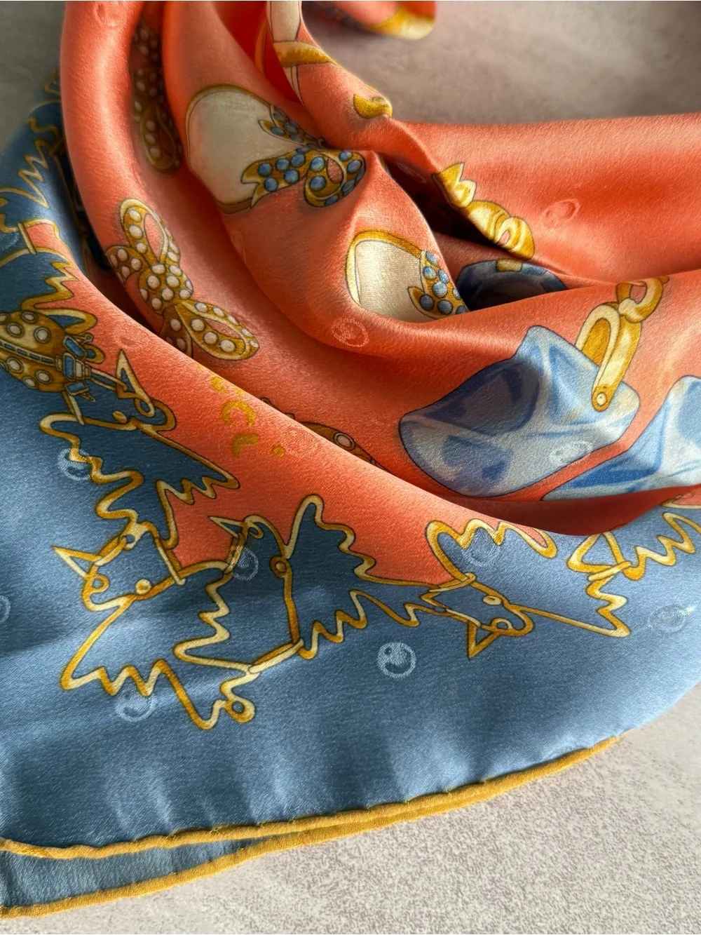 Nina Ricci Coral Scarf with Blue and Gold Jewelry Motifs